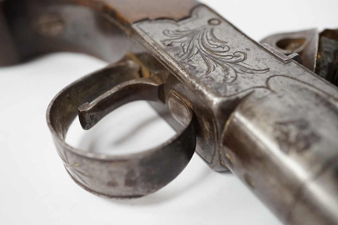 A boxlock flintlock pocket pistol with turn off barrel, Birmingham proof, frame engraved with flag trophy and foliage signed Boston within oval, sliding top thumb safety, slab walnut grip. Condition - fair to good.